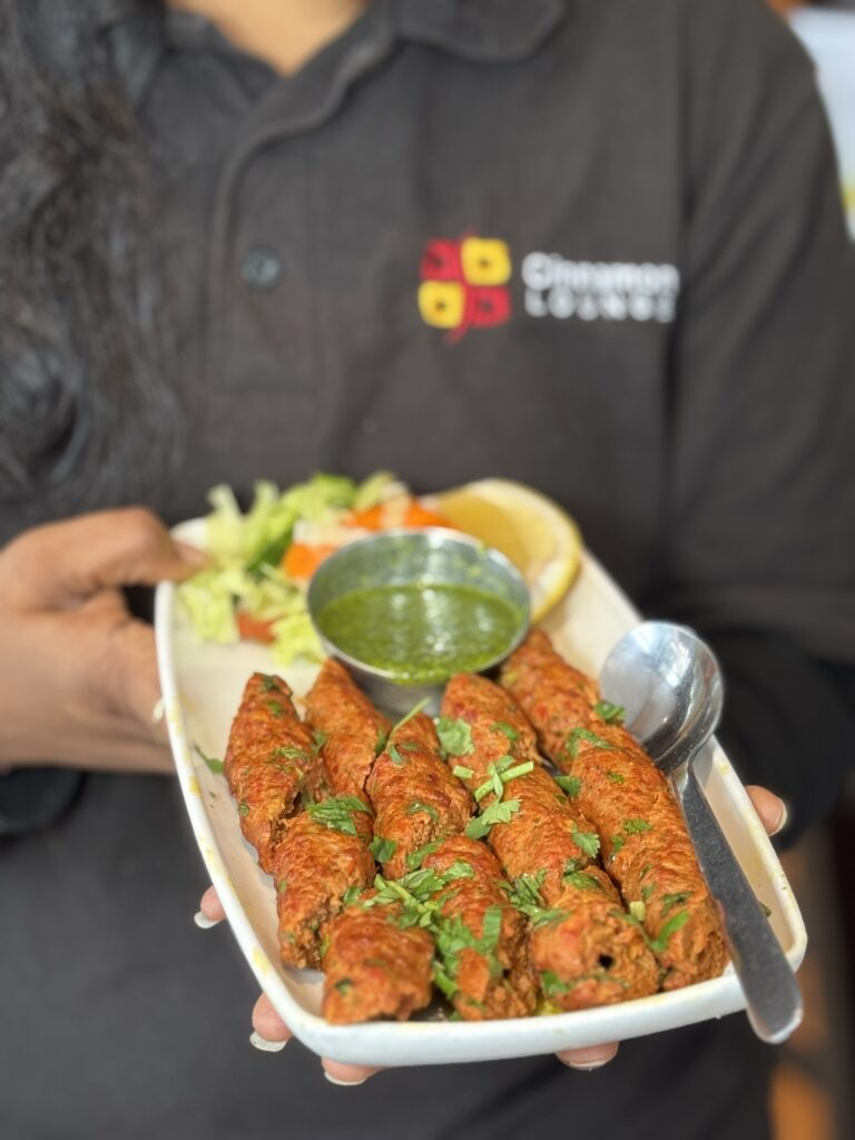Freshly-grilled-seekh-kebab-platter-served-with-mint-chutney-and-salad-at-Cinnamon-Lounge.