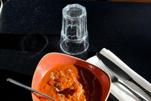 Rich-chicken-tikka-masala-curry-in-terracotta-dish-served-at-Cinnamon-Lounge.