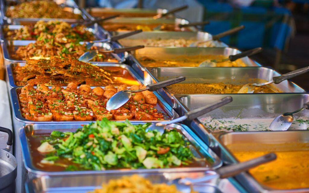 buffet-spread-of-authentic-asian-dishes-in-stainless-steel-chafing-trays-at-cinnamon-lounge
