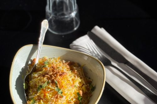 Saffron-basmati-biryani-garnished-with-crispy-onions-served-at-Cinnamon-Lounge.