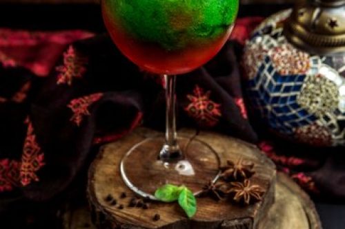Red-green-cocktail-topped-with-lemon